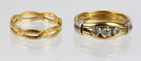 Three stone diamond ring, three graduated round brilliant cut diamonds rubover set in white gold,