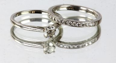 Single stone diamond ring and half eternity ring, the single stone ring set with a round brilliant