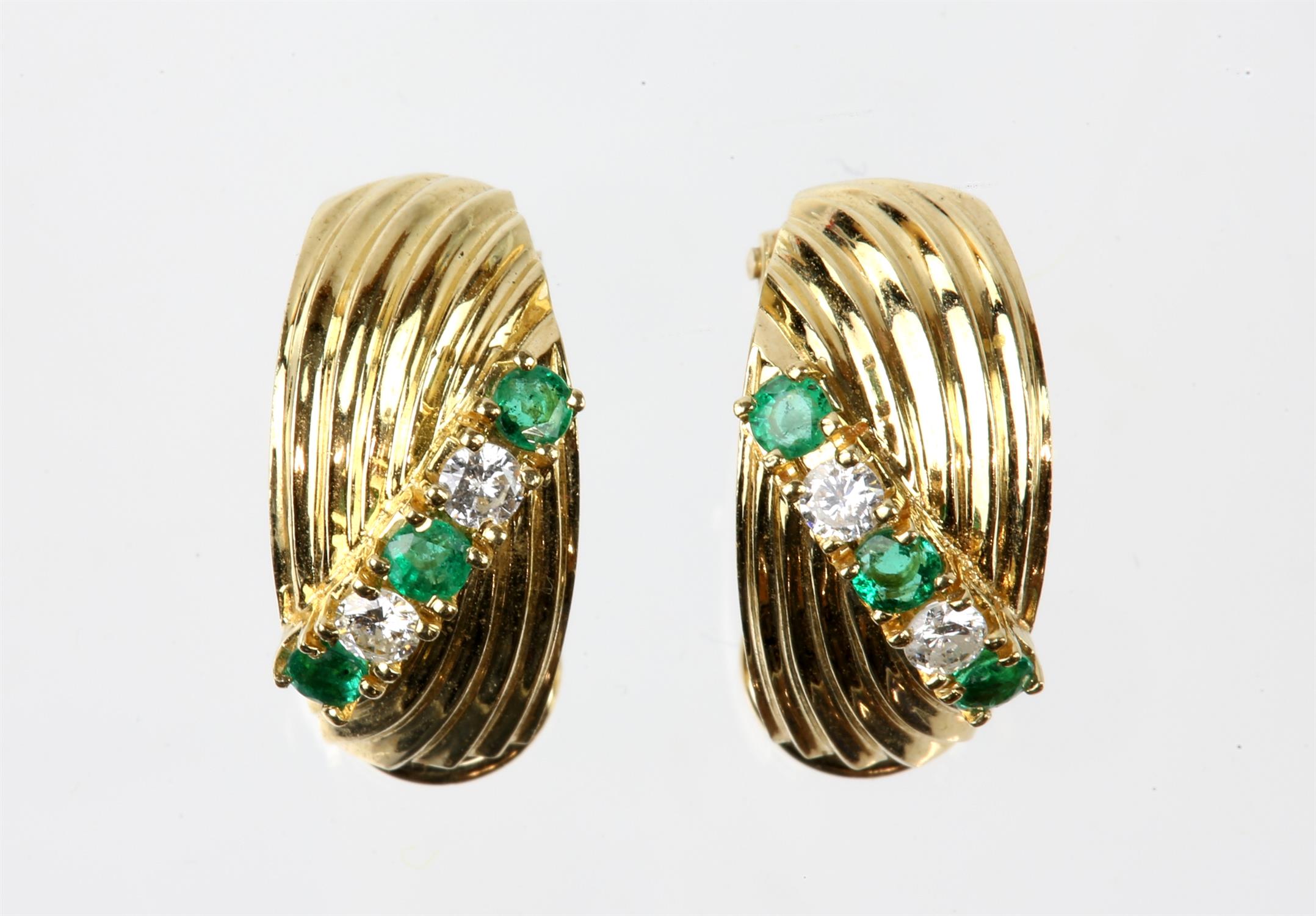 Pair of emerald and diamond clip-on earrings, each earring consisting of three round cut emeralds