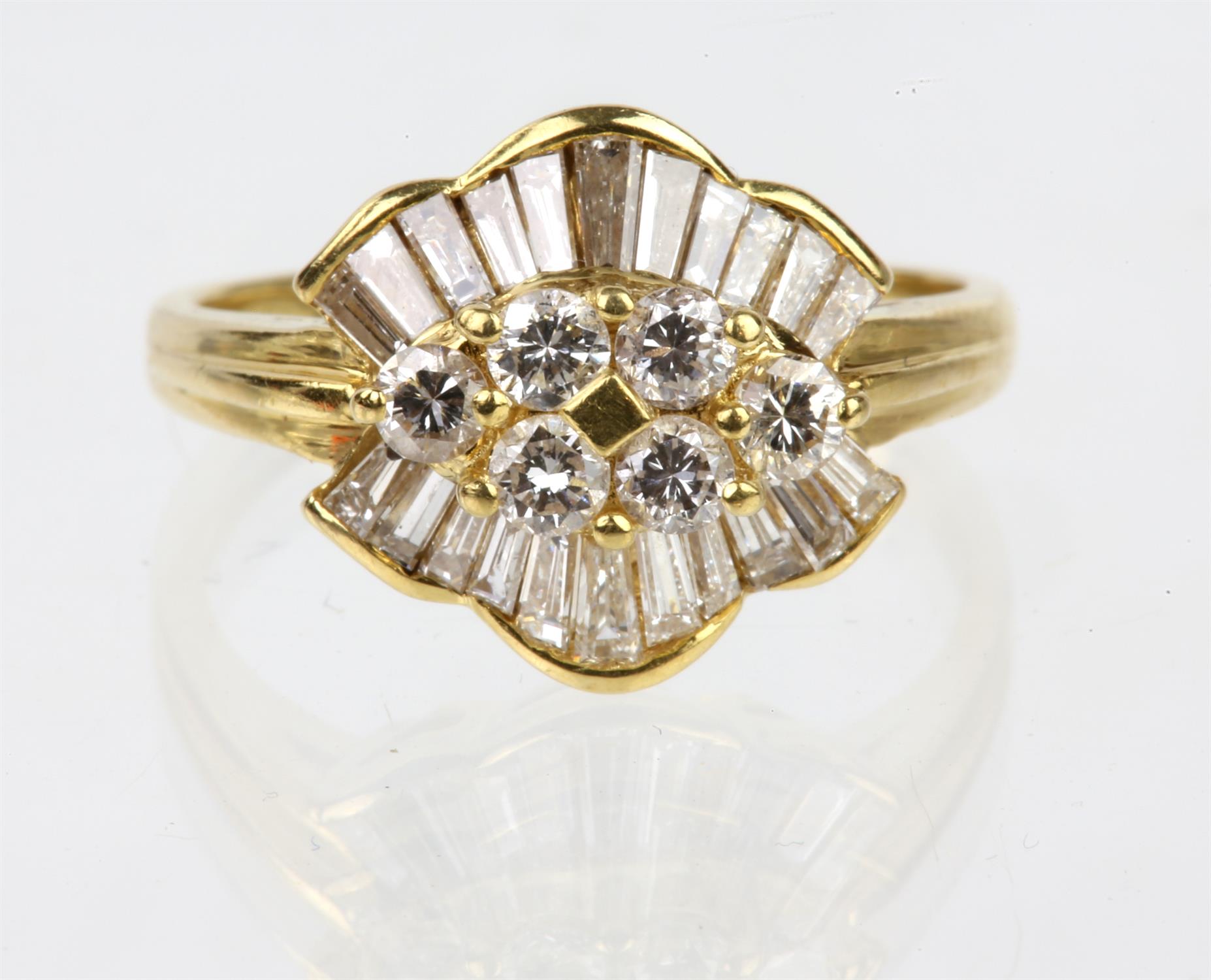 A diamond set dress ring, with six round brilliant cut diamonds set at the centre,