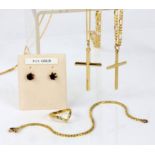 A selection of gold jewellery including two cross pendants on chains, a bracelet and a pair of