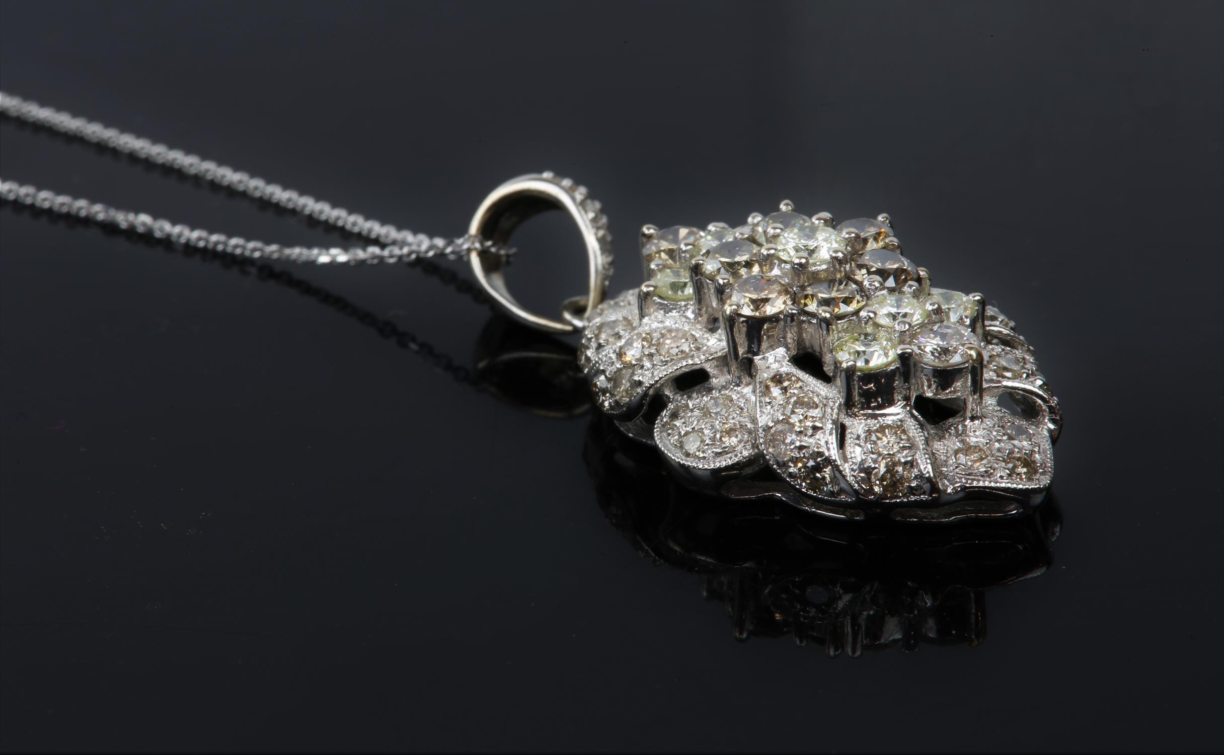 Diamond set pendant, round brilliant diamonds set in a floral cluster design, in stamped 18ct white - Image 5 of 7