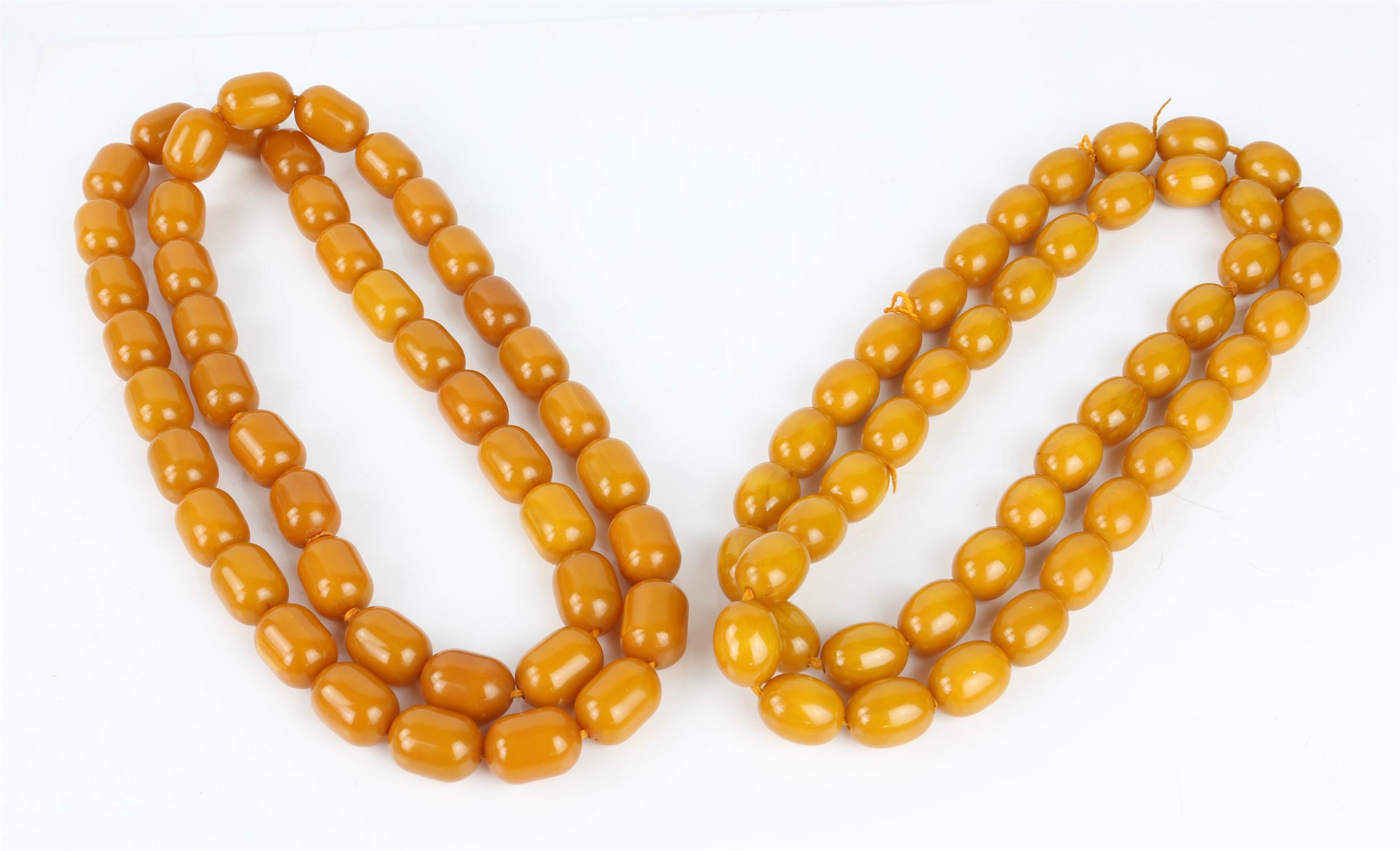 Three amber style necklaces including two amber bead necklaces, a resin and lapis bead necklace and - Image 2 of 2