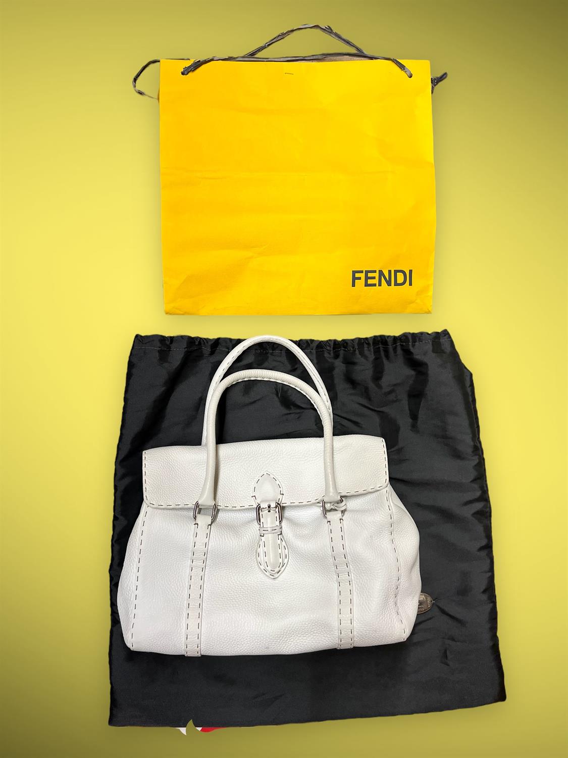 One white leather FENDI top handle flap handbag with silver coloured hardware. Comes with dust bag