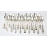 Collection of eighteen George III and later silver table spoons, 35.4 ozs 1102 grams SILVER