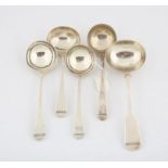 Four George III silver sauce ladles and a sauce ladle marked sterling, 8.9 ozs 278 grams SILVER