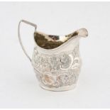 George III, silver cream jug decorated with flowers foliage and scrolls, London 1802,