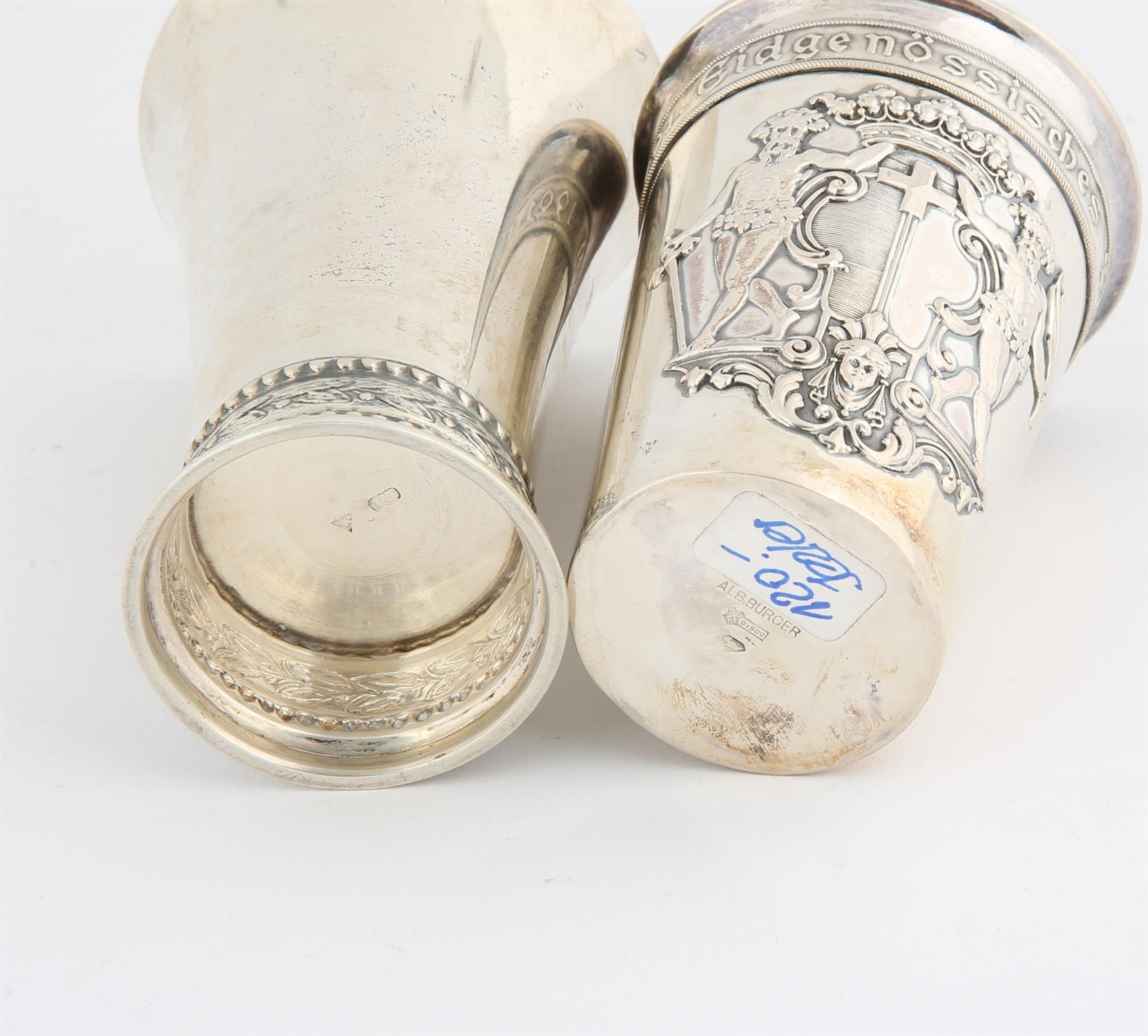 Continental silver beaker wirh coat of arms in relief and a second beaker, both late 19th and early - Image 2 of 2