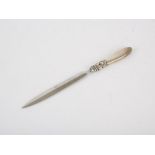 Georg Jensen - A Danish silver paper knife with an open flower bud to terminal, length 21cm,