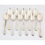 Eleven various George III and later Old English pattern silver dessert spoons, 9.