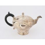 Early Victorian foliate embossed globular silver teapot with engraved presentation cartouche,