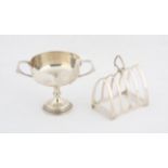 George V silver two handled cup Sheffield 1924 and a silver toast rack. total weight 9.4 ozs,