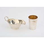 Plain oval silver sauce boat with beaded borders and an inscribed silver beaker, 8.