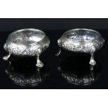 Pair of George III round silver salts with embossed floral decoration, no liners, 2.