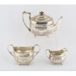 George III silver three piece tea service, comprising treapot, sugar bowl and cream jug,