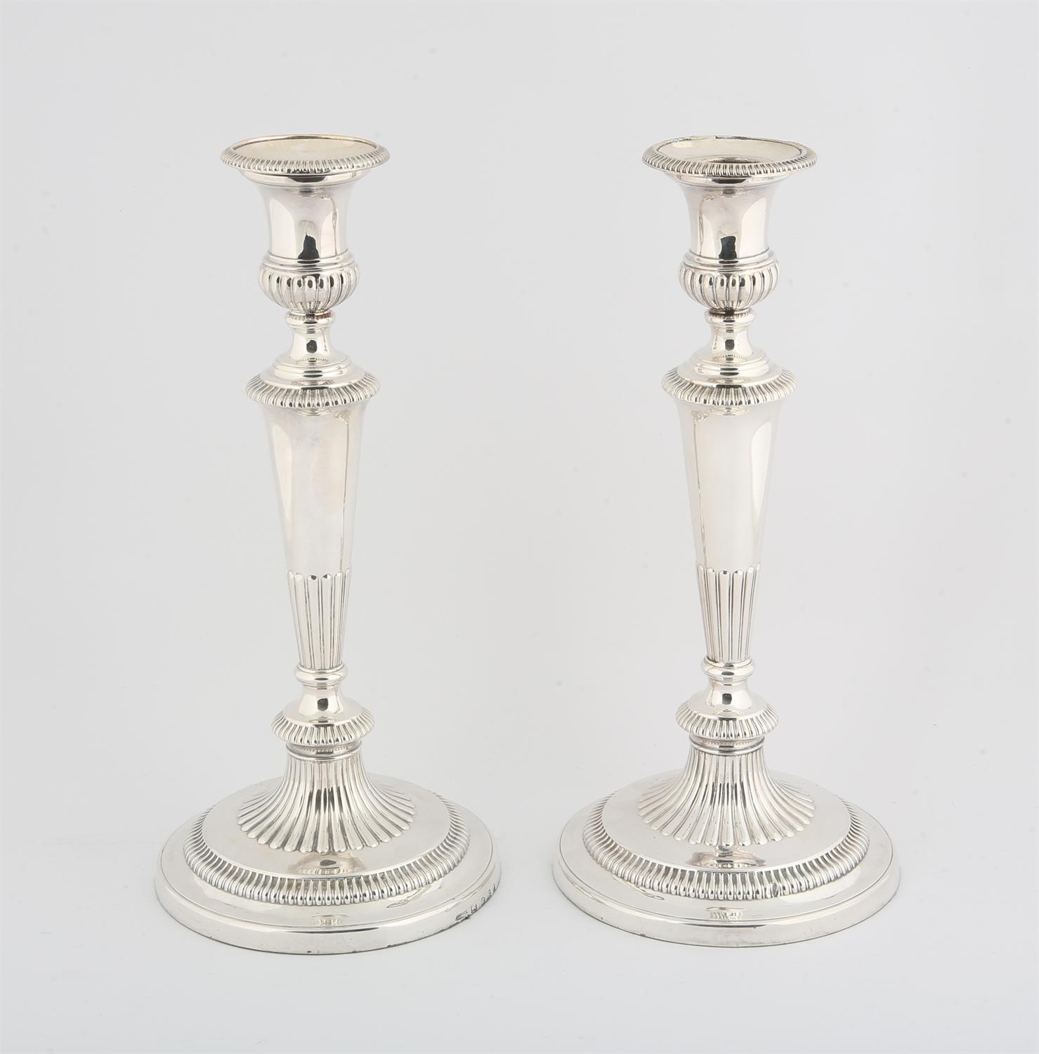 Pair of George III silver gadrooned candlesticks on tapering stems, Sheffield 1805,