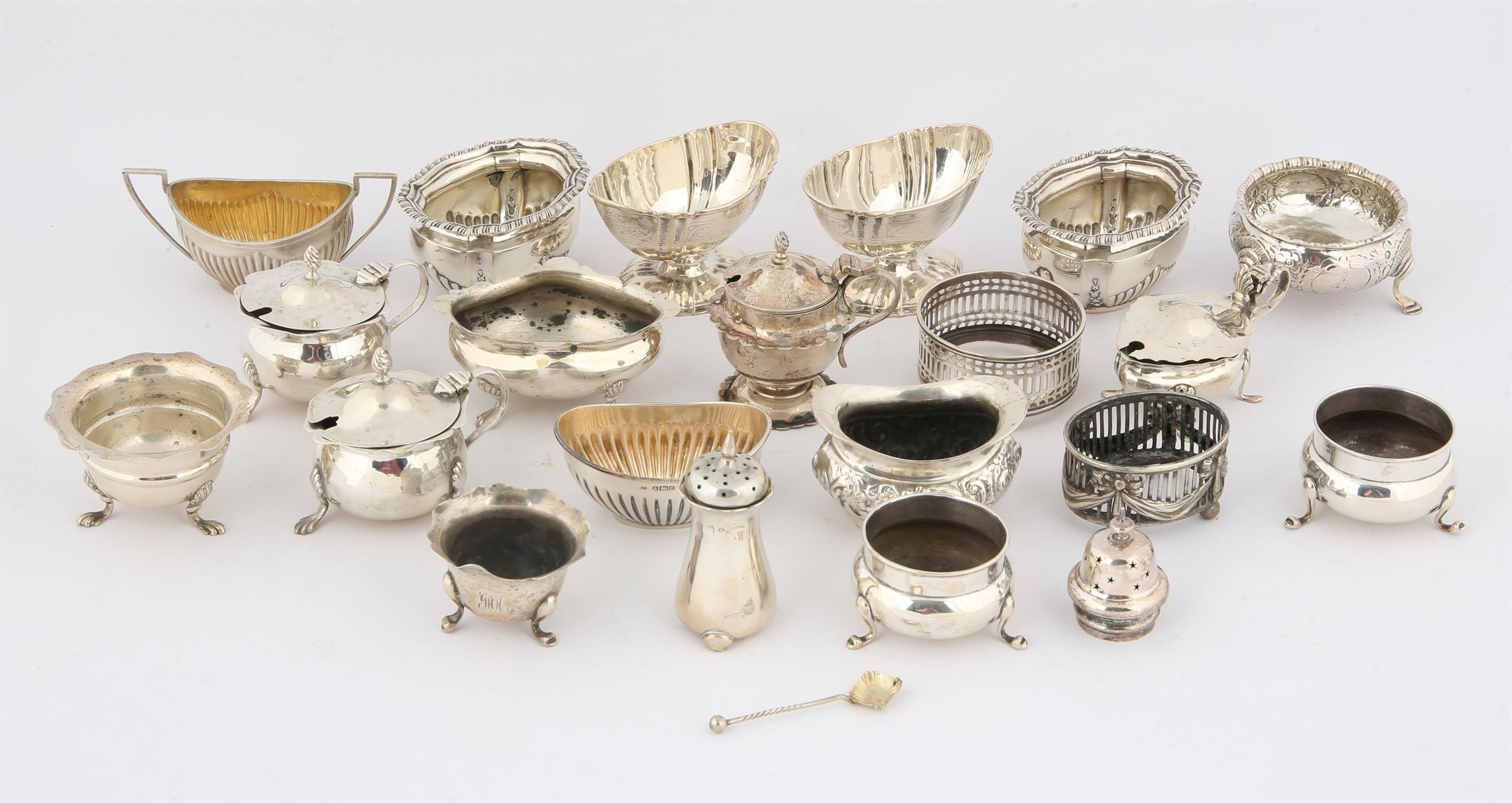 Nineteen various silver salts, mustard pots etc. with some blue glass liners, 20.