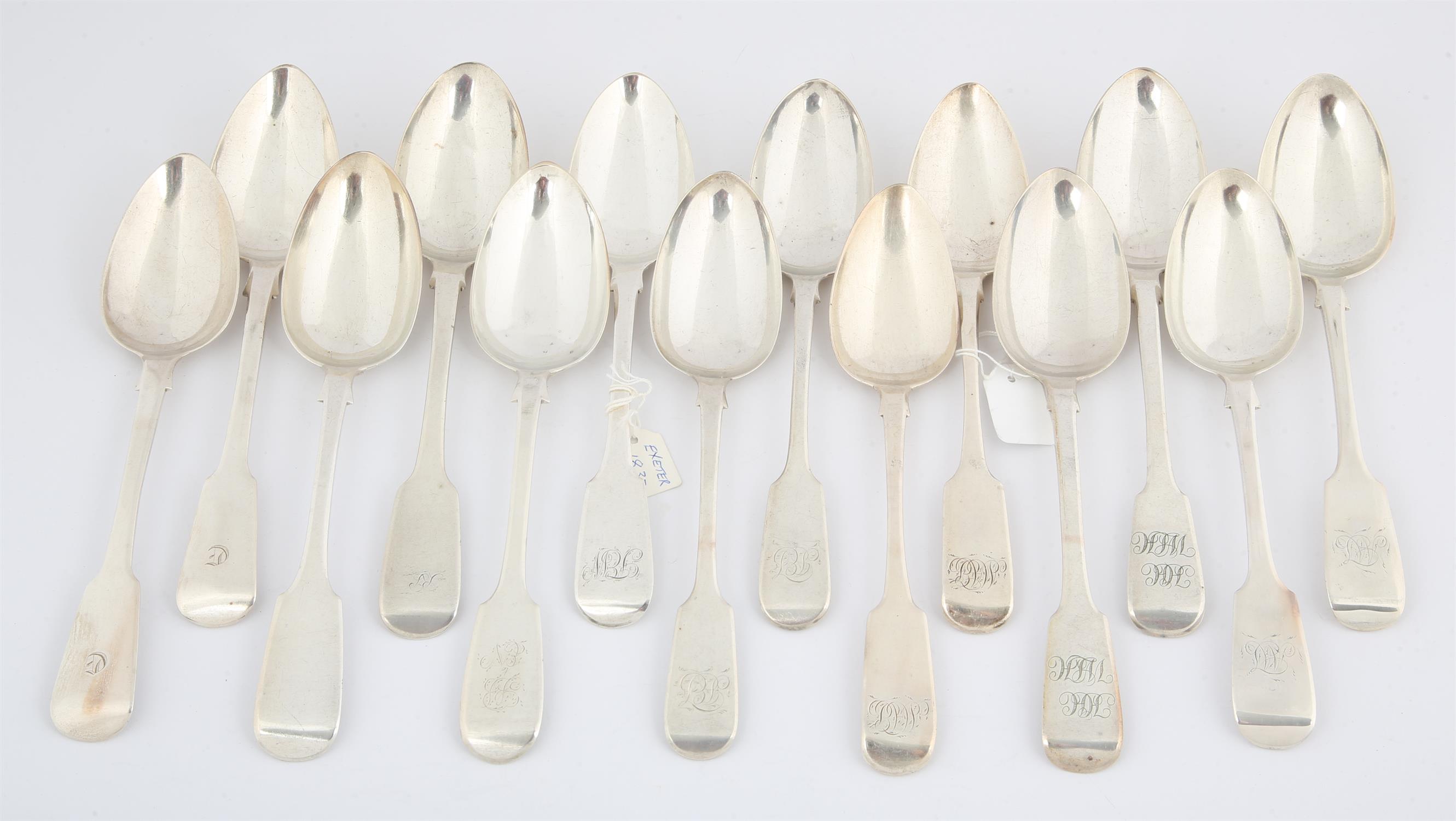 Fourteen various 18th and 19th century English provincial silver fiddle pattern table spoons,