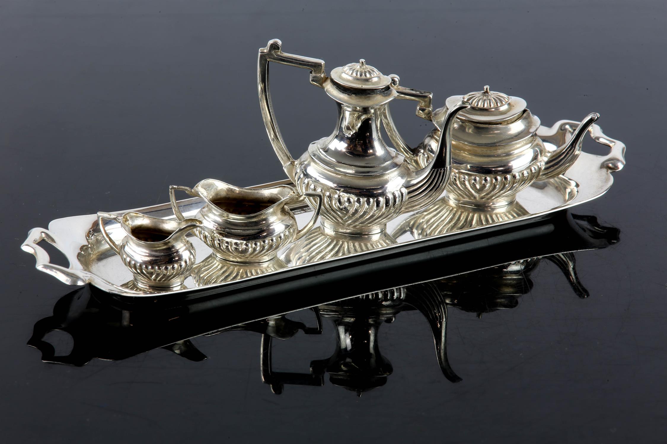 Miniature silver four piece fluted oval coffee and tea service on a rectangular tray by S J Rose &