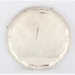 George V silver salver with gadrooned border on hoof feet by Barker Brothers Silver Ltd,