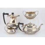 George VI, oval fluted silver four piece tea and coffee service, makers S&W, Birmingham 1937,