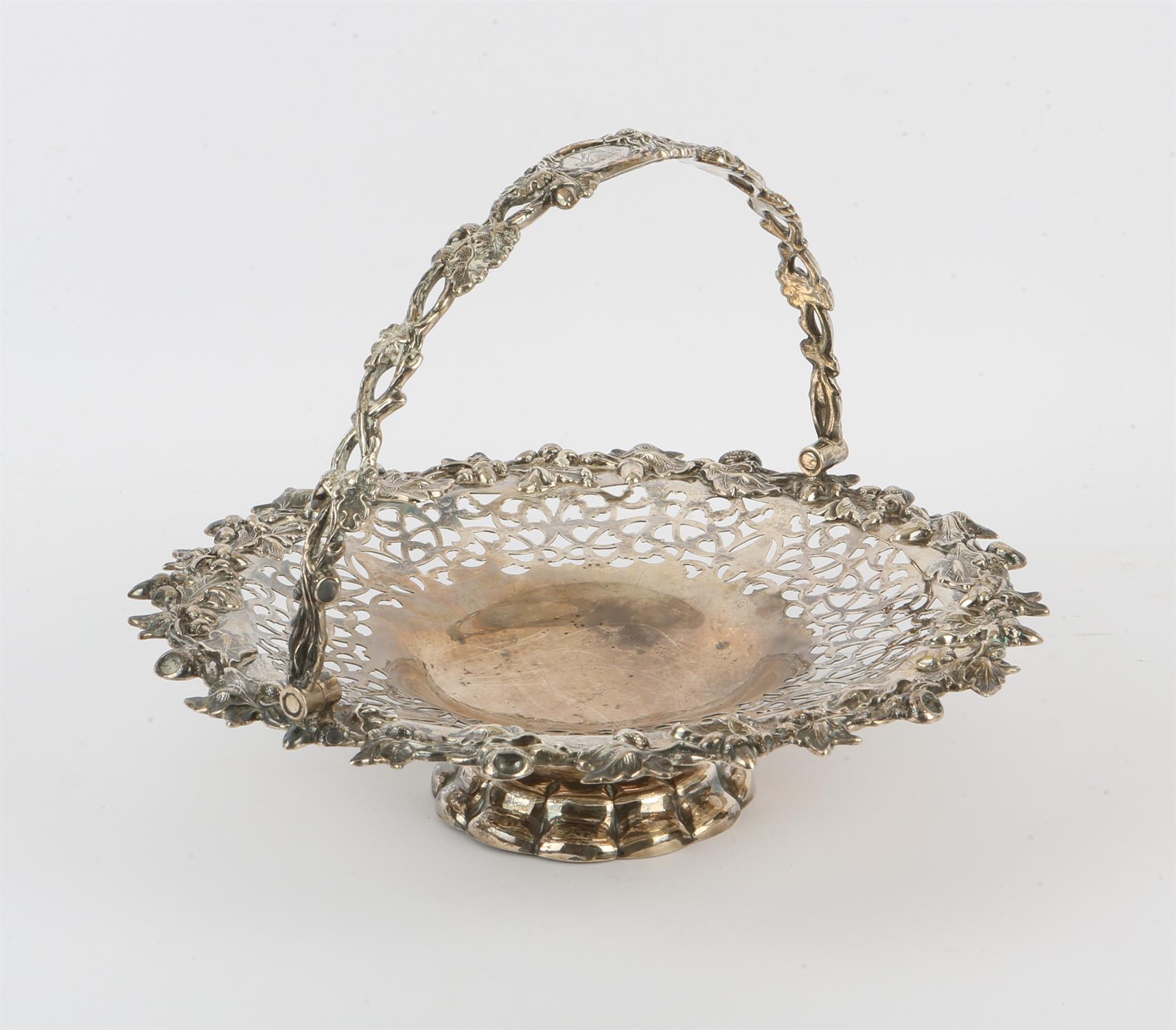 Victorian silver swing-handled cake basket, with pierced scrolling decoration and oak leaf and