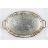 Canadian silver two handled tea tray with shaped border, engraved with foliate scrolls,