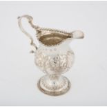 George III silver cream jug, with embossed floral decoration, London 1816, 2.6 ozs,