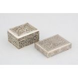 Two embossed Middle Eastern or Indian, probably silver boxes, 11 cms and 12 cms, 15.