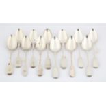 Twelve various silver fiddle pattern dessert spoons, George III and later, 13.6 ozs,