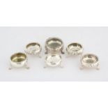 Pair of 19th Century embossed silver round salts and four other round open salts, 11.