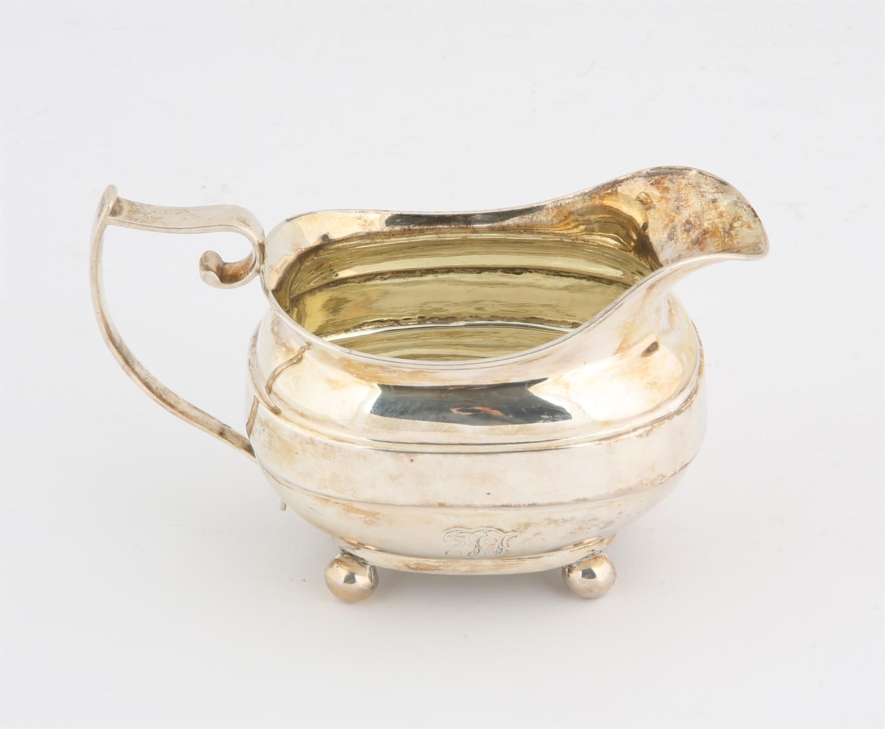 George III silver flat bottom cream jug, on ball feet. the base with contemporary presentation