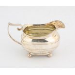 George III silver flat bottom cream jug, on ball feet. the base with contemporary presentation