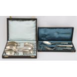 800 standard cased silver spoon and fork with a knife, and an 800 standard set of beaded cutlery