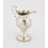 Victorian silver cream jug , decorated with embossed flowers and foliage, Chester 1897, 4.
