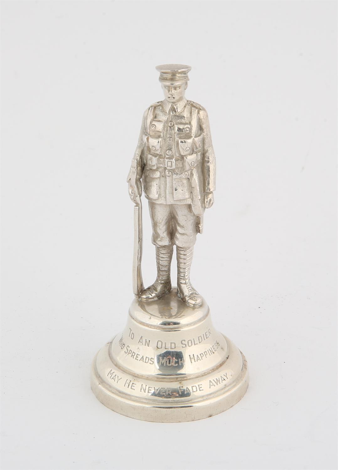 WWI Cast Silver Regimental figure of a soldier in Battle Dress inscribed "to an old soldier who