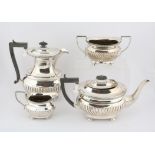 Silver coffee pot, tea pot, sugar bowl and cream jug of oval reeded design by Joseph Gloster Ltd,