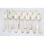 Thirteen various George III and later English provincial silver fiddle pattern table spoons,