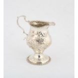 George III silver cream jug with embossed flower and foliage decoration, London, 2.