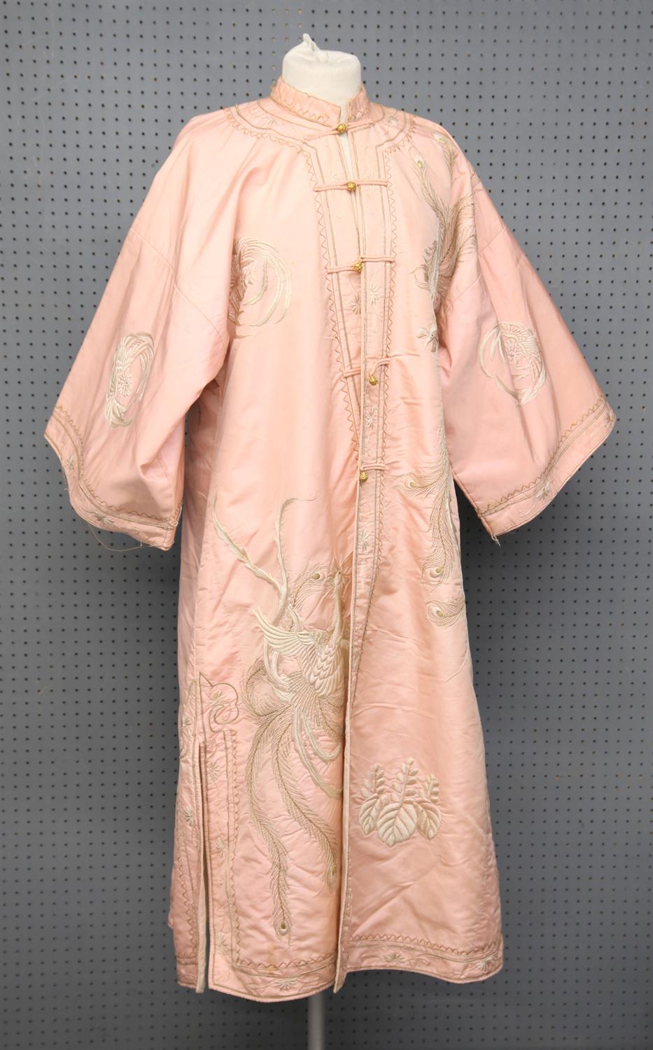 A Chinese pink robe embroidered with a peacock, Republic period. 125 cm long