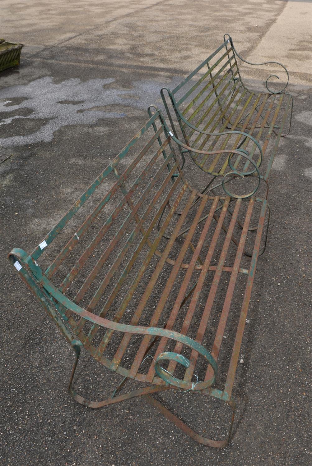 Two wrought iron green painted garden benches, scrolling arms and legs with slatted seats, - Image 3 of 3