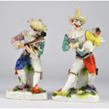 NOTE THE FIGURE WITH VIOLIN BOW IS NOW BROKEN Pair of Vienna porcelain figures in harlequin