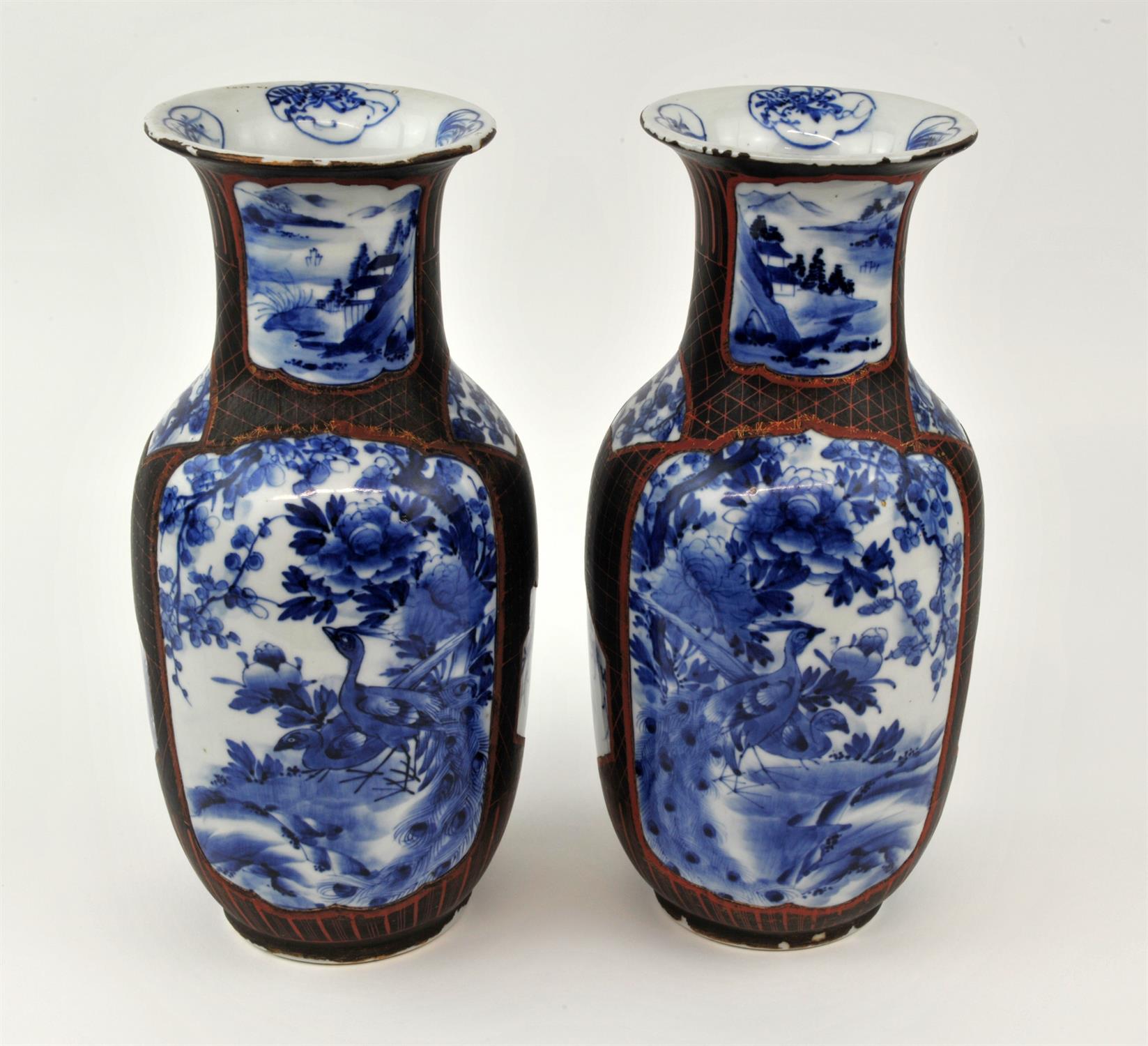 Pair of Japanese lacquered vases, Meiji period, the slender ovoid bodies decorated in underglaze