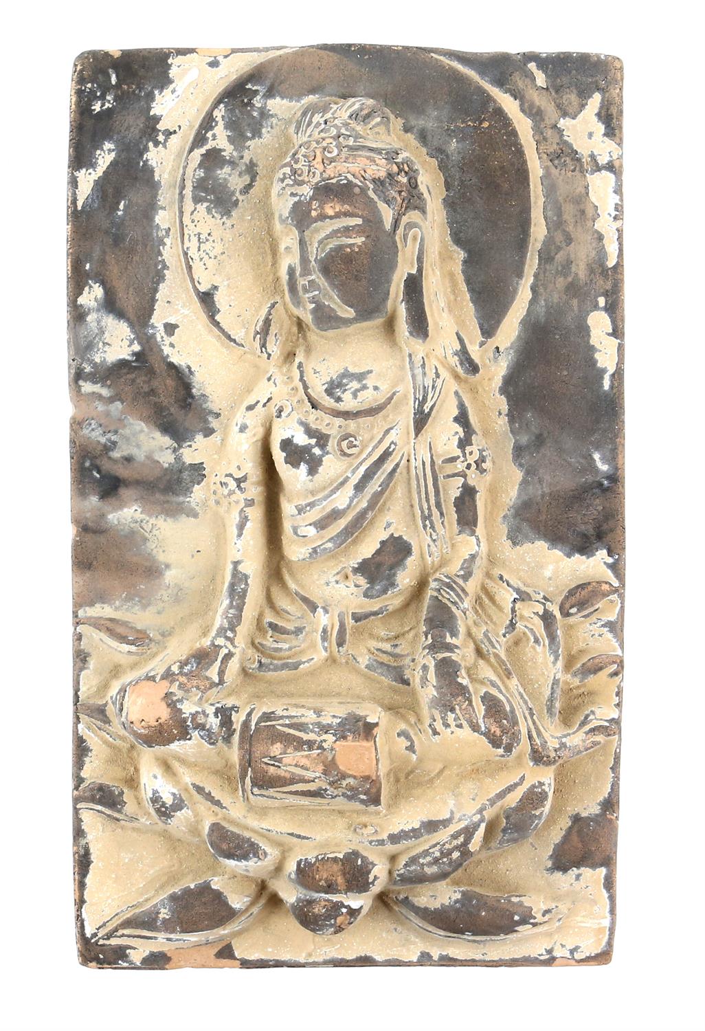 An unglazed terracotta tile with traces of polychrome decoration of a Guanyin, possibly Tang