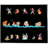 Twelve Mahogany-mounted Hand-Painted Long Magic Lantern Slides. Each with comic figures and approx