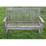 Slatted wood garden bench 122 cm long x 57cm deep x 88cm high.