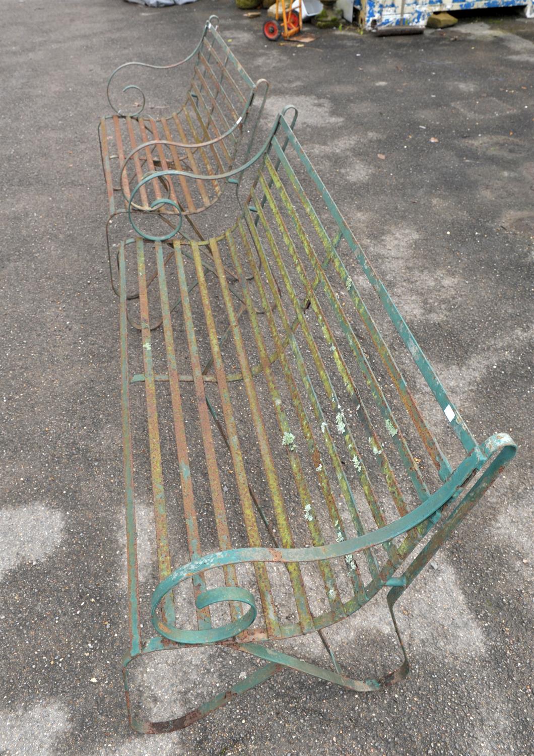 Two wrought iron green painted garden benches, scrolling arms and legs with slatted seats, - Image 2 of 3