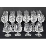 A part suite of Waterford glassware, etched marks to base, to comprise 12 flutes, 20 cm high,