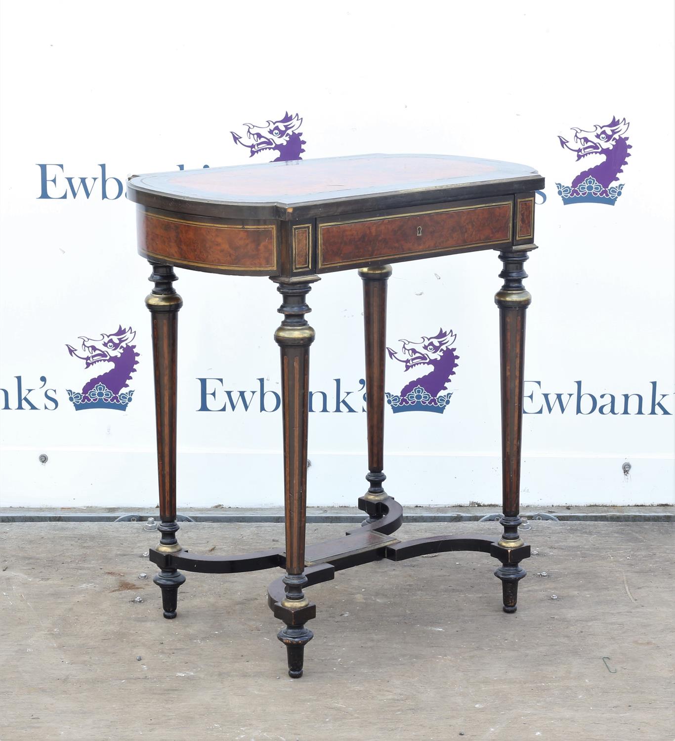 19th century French amboyna and ebonised dressing table, with brass inlay, the hinged top with