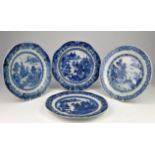 Four Chinese blue and white plates with patterned borders and decorated with figures on a bridge